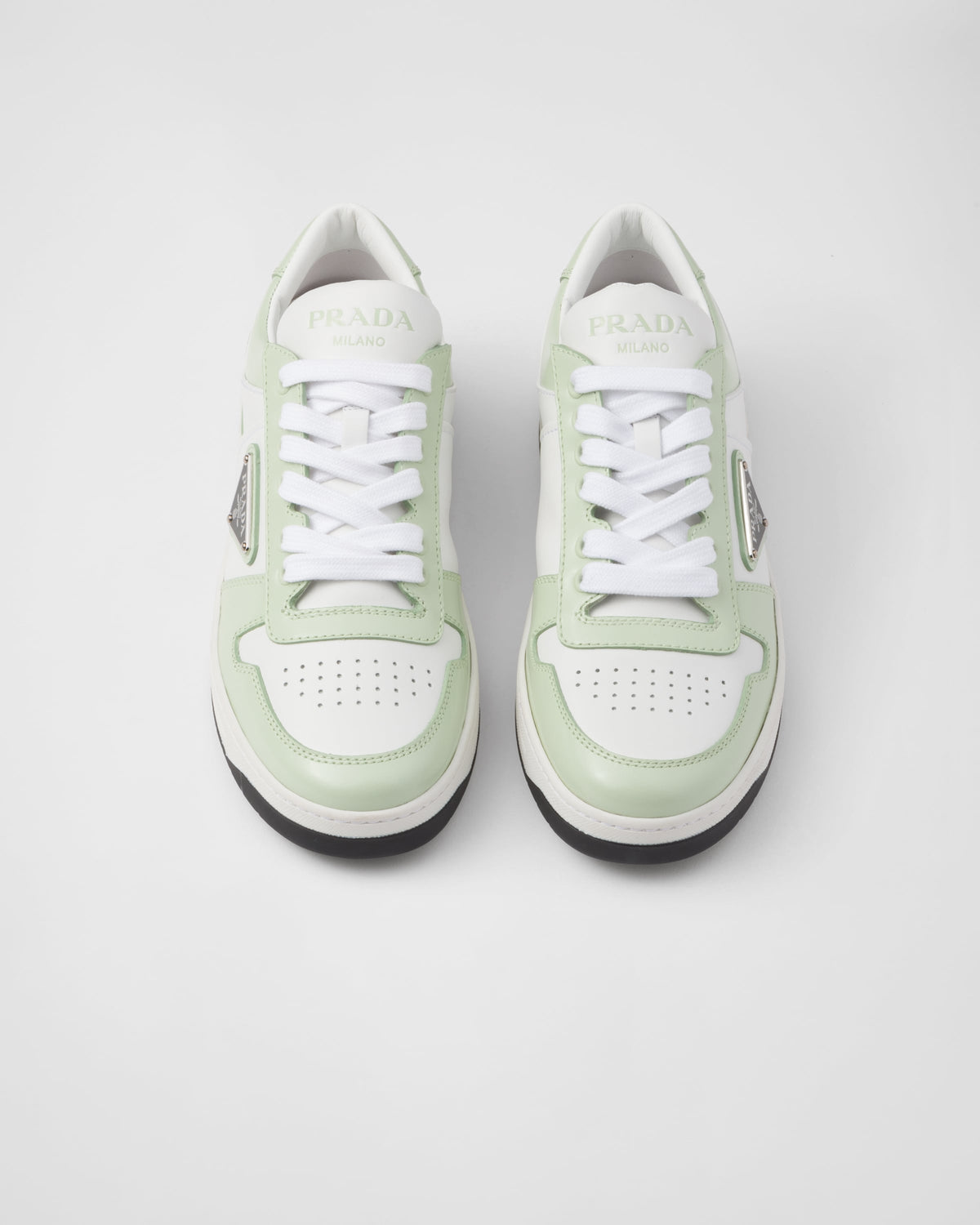 Downtown leather and rubber sneakers – perforated motif on the upper Leather lining Enameled metal triangle logo Lace-ups – LUX VERSE Luxury Designer Fashion Outlet