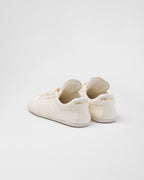 Leather sporty sneakers – the casual and versatile style is embellished with the embossed rubber triangle logo – LUX VERSE Luxury Designer Fashion Outlet
