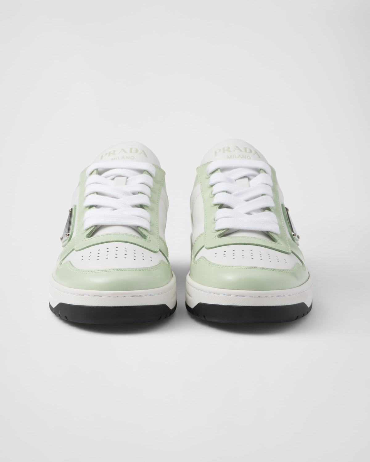Downtown leather and rubber sneakers – perforated motif on the upper Leather lining Enameled metal triangle logo Lace-ups – LUX VERSE Luxury Designer Fashion Outlet