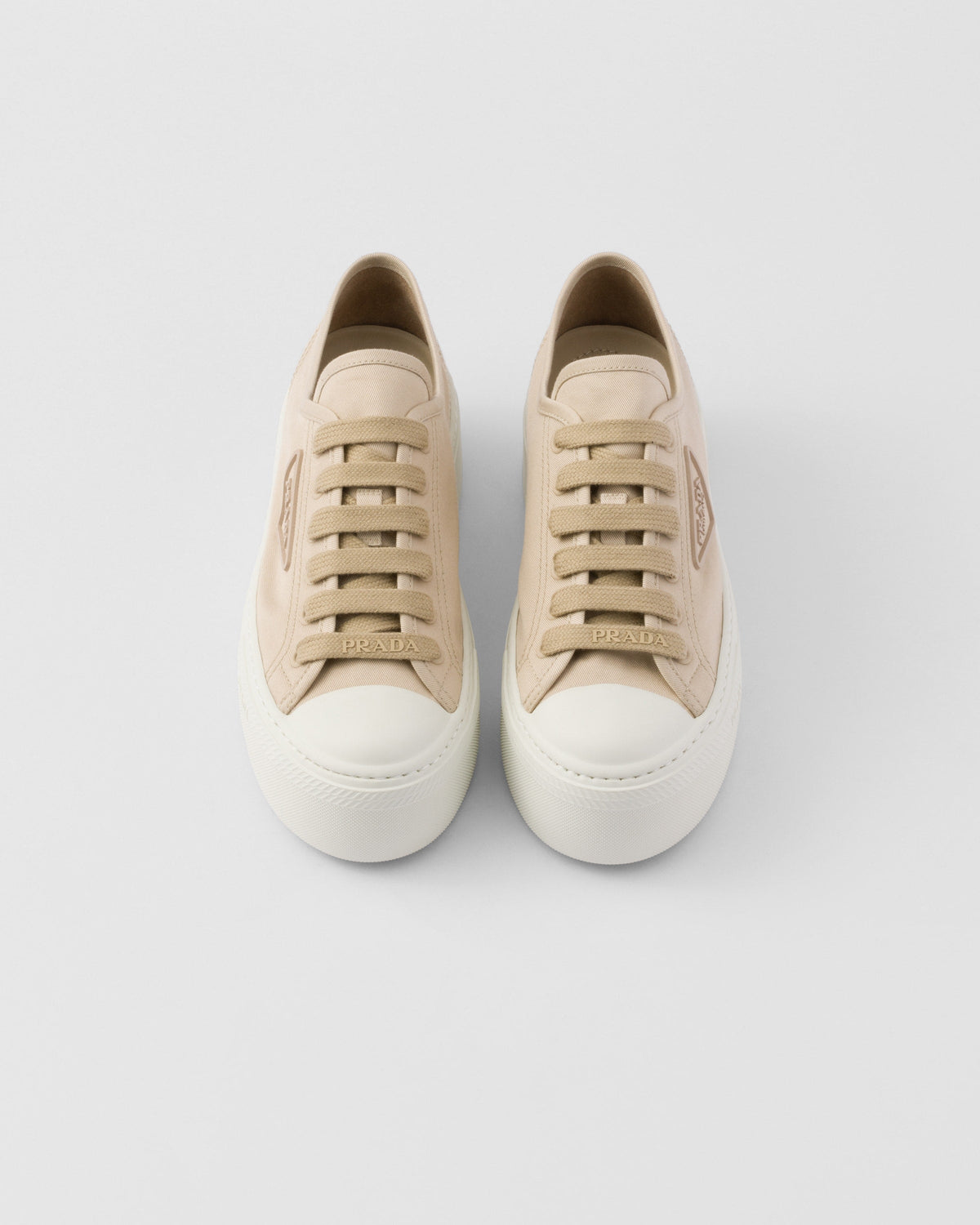 Laced sneakers – the casual and versatile style is embellished with the embossed rubber triangle logo – LUX VERSE Luxury Designer Fashion Outlet