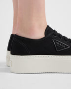 Fabric sneakers – the casual and versatile style is embellished with the embossed rubber triangle logo – LUX VERSE Luxury Designer Fashion Outlet