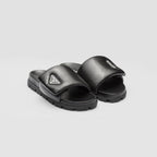 Soft padded nappa leather slides – upper with enameled metal triangle logo 20 mm rubber sole Lug tread Material Leather – LUX VERSE Luxury Designer Fashion Outlet
