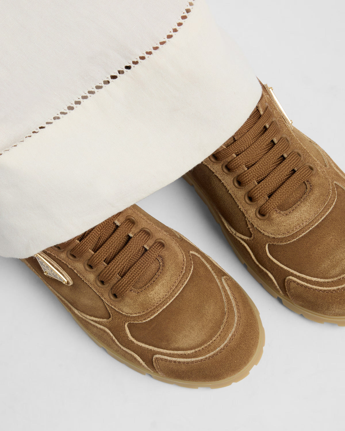 Trail faded suede sneakers – upper with shaded effect Leather lining Enameled metal triangle logo Polyester laces – LUX VERSE Luxury Designer Fashion Outlet