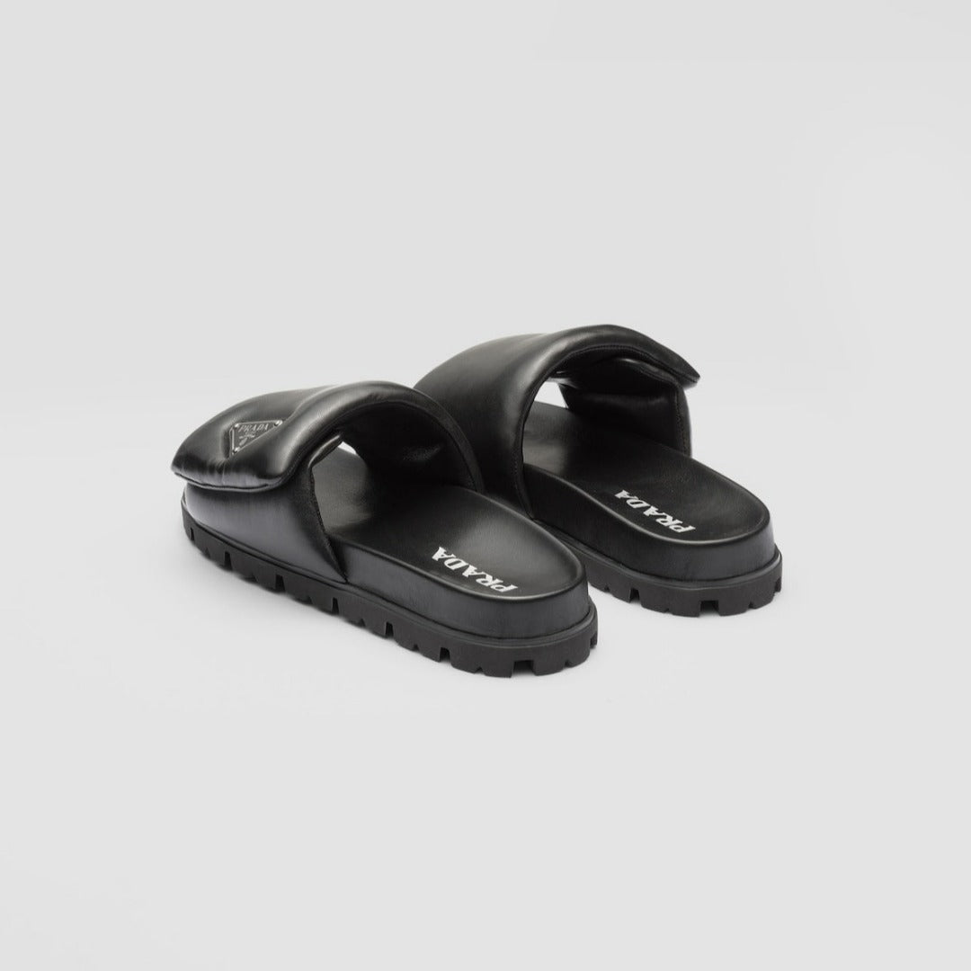 Soft padded nappa leather slides – the triangle logo stands out on the accessory – LUX VERSE Luxury Designer Fashion Outlet