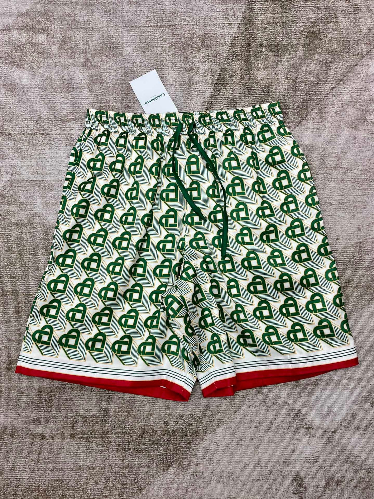 Grüne Seidenshorts mit Monogramm – Herren