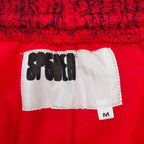 Rote Jogginghose mit Spinnenweben-Print – Herren