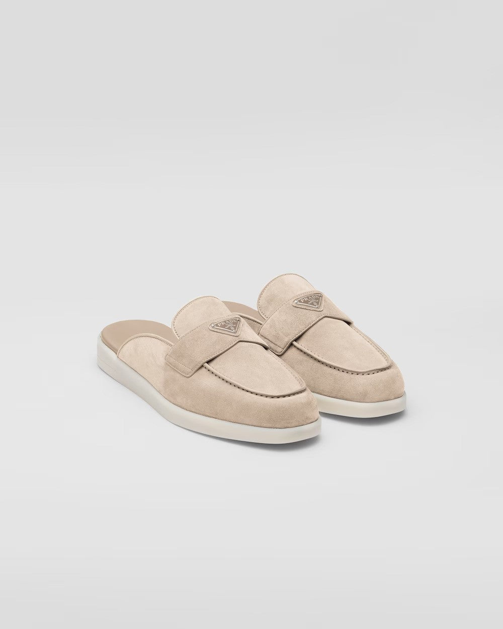 Suede sabots – the enameled metal triangle logo stands out on the front – LUX VERSE Luxury Designer Fashion Outlet
