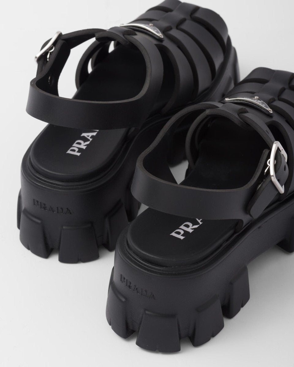 Foam rubber sandals – upper with metal buckle Enameled metal triangle logo Rubber sole: 55 mm Fabric pouch – LUX VERSE Luxury Designer Fashion Outlet