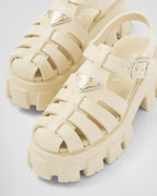 Foam rubber sandals – upper with metal buckle Enameled metal triangle logo Rubber sole: 55 mm Fabric pouch – LUX VERSE Luxury Designer Fashion Outlet