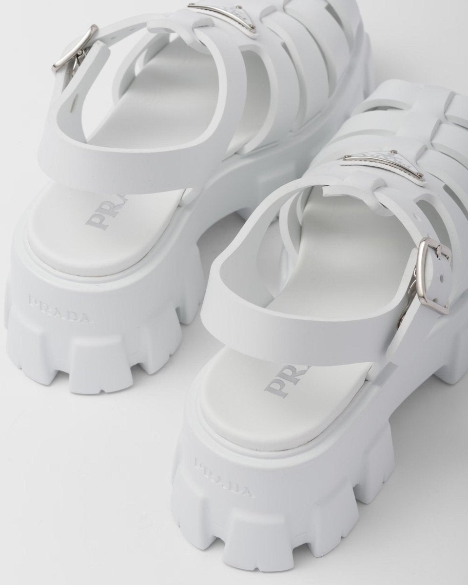 Foam rubber sandals – upper with metal buckle Enameled metal triangle logo Rubber sole: 55 mm Fabric pouch – LUX VERSE Luxury Designer Fashion Outlet
