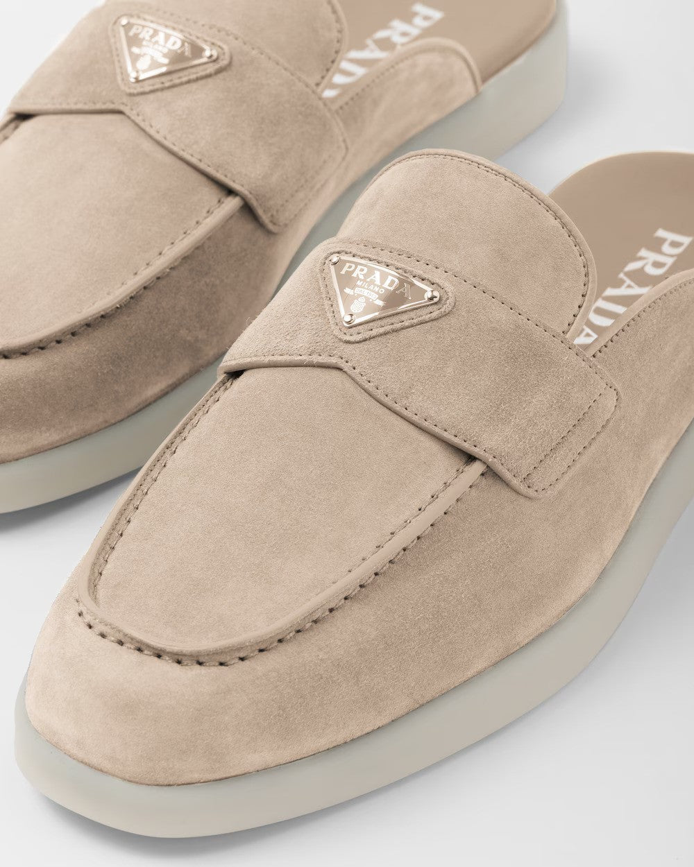 Suede sabots – the enameled metal triangle logo stands out on the front – LUX VERSE Luxury Designer Fashion Outlet