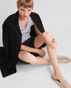 Suede sabots – the enameled metal triangle logo stands out on the front – LUX VERSE Luxury Designer Fashion Outlet
