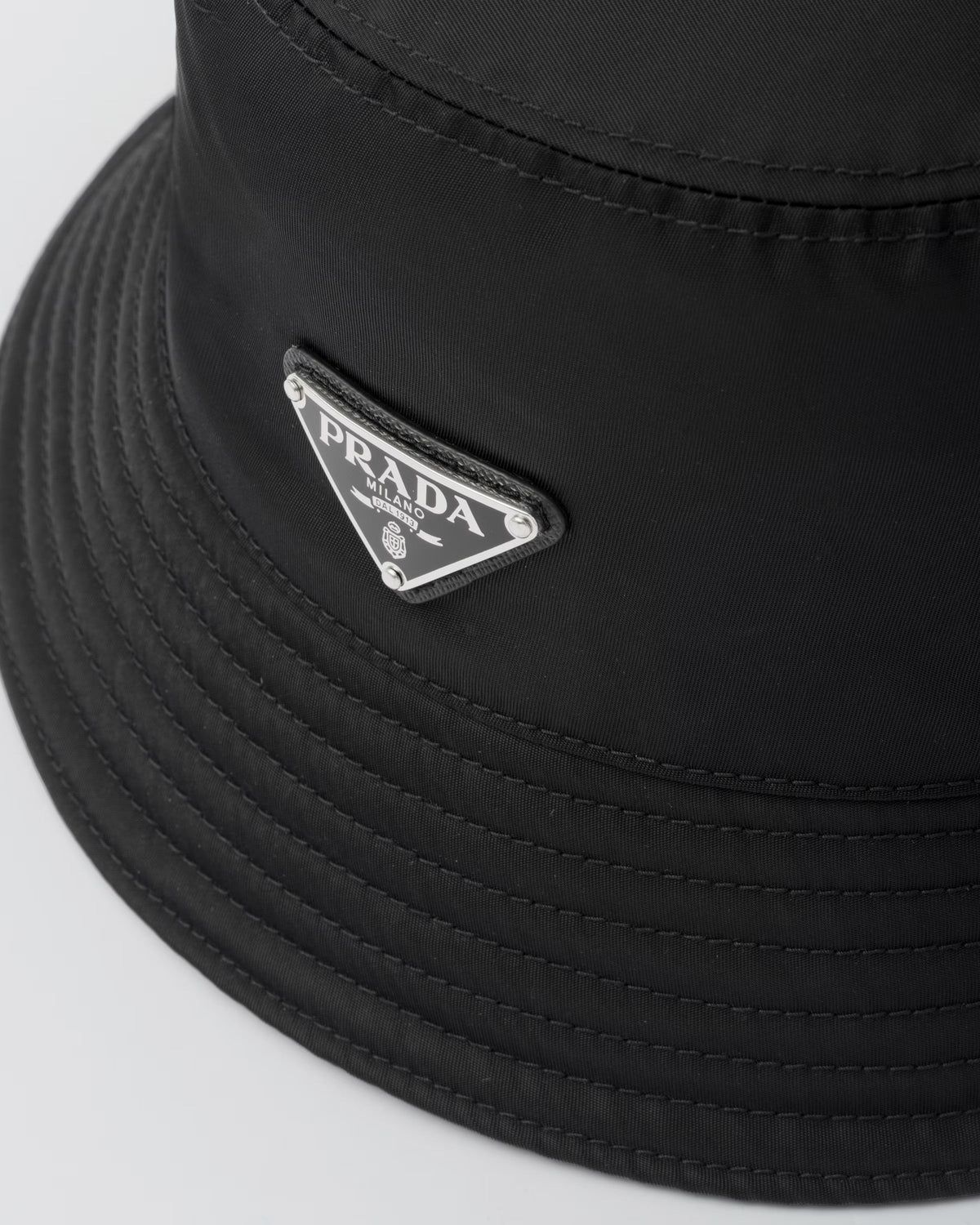 Re-Nylon bucket hat – this bucket hat, an iconic accessory of collections, is made of Re-Nylon: – LUX VERSE Luxury Designer Fashion Outlet