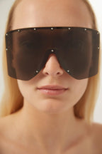 Black bold 80s inspired mask sunglasses – Lettering Logo on the gold metal plaque on temples highlights the materials – LUX VERSE Luxury Designer Fashion Outlet