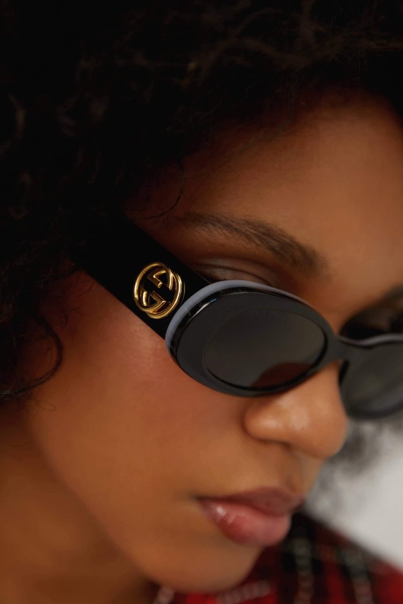 Black oval sunglasses – the black tone its combined with mother of pearl tones color palette in connection – LUX VERSE Luxury Designer Fashion Outlet