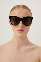 Cat-eye black sunglasses – there’s a golden light; Marcello, an aspiring novelist is taking a stroll and out – LUX VERSE Luxury Designer Fashion Outlet