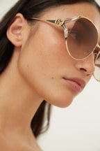 Fork metal brown sunglasses – the SKUs are enriched with enamel details recalling the institutional web – LUX VERSE Luxury Designer Fashion Outlet