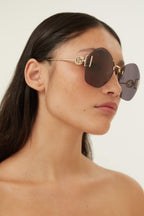 Overzized rimless sunglasses – metal temples presenting the GG interlocking logo and a dedicated fork – LUX VERSE Luxury Designer Fashion Outlet