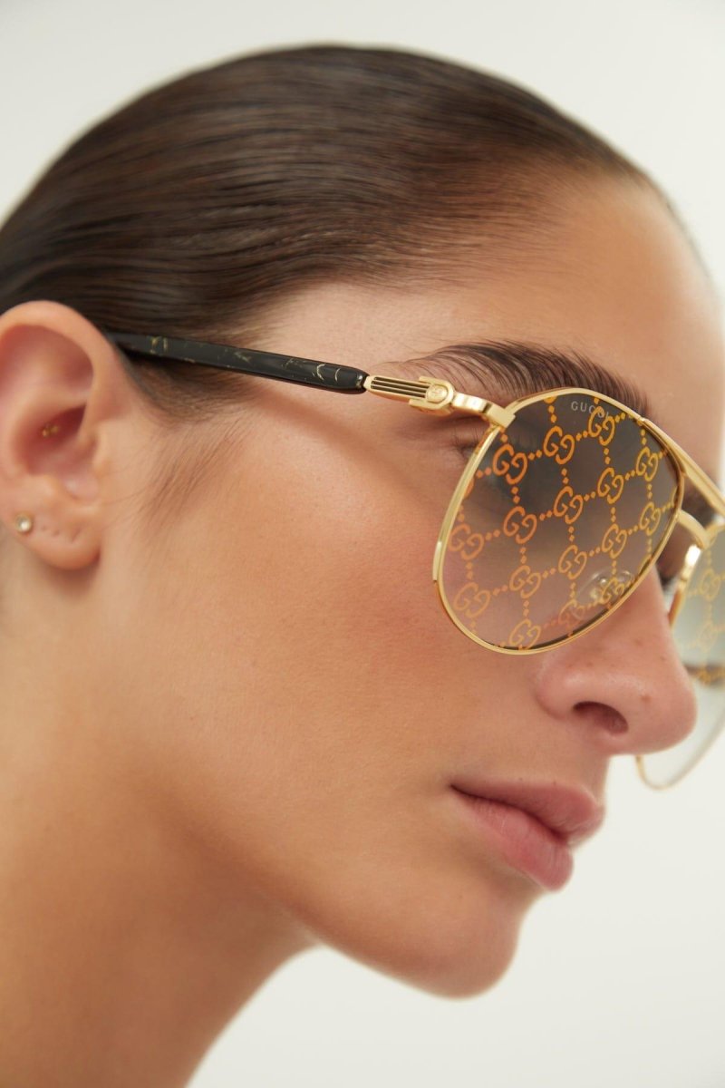 Pilot all over logo metal sunglasses – to make this style even more recognizable one sku has the Guccissima lenses – LUX VERSE Luxury Designer Fashion Outlet