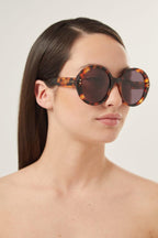 Round havana sunglasses – there’s a golden light; Marcello, an aspiring novelist is taking a stroll and out – LUX VERSE Luxury Designer Fashion Outlet