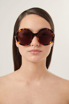 Round havana sunglasses – close your eyes and drift back in time…you’re in Piazza del Popolo in Rome, it’s – LUX VERSE Luxury Designer Fashion Outlet