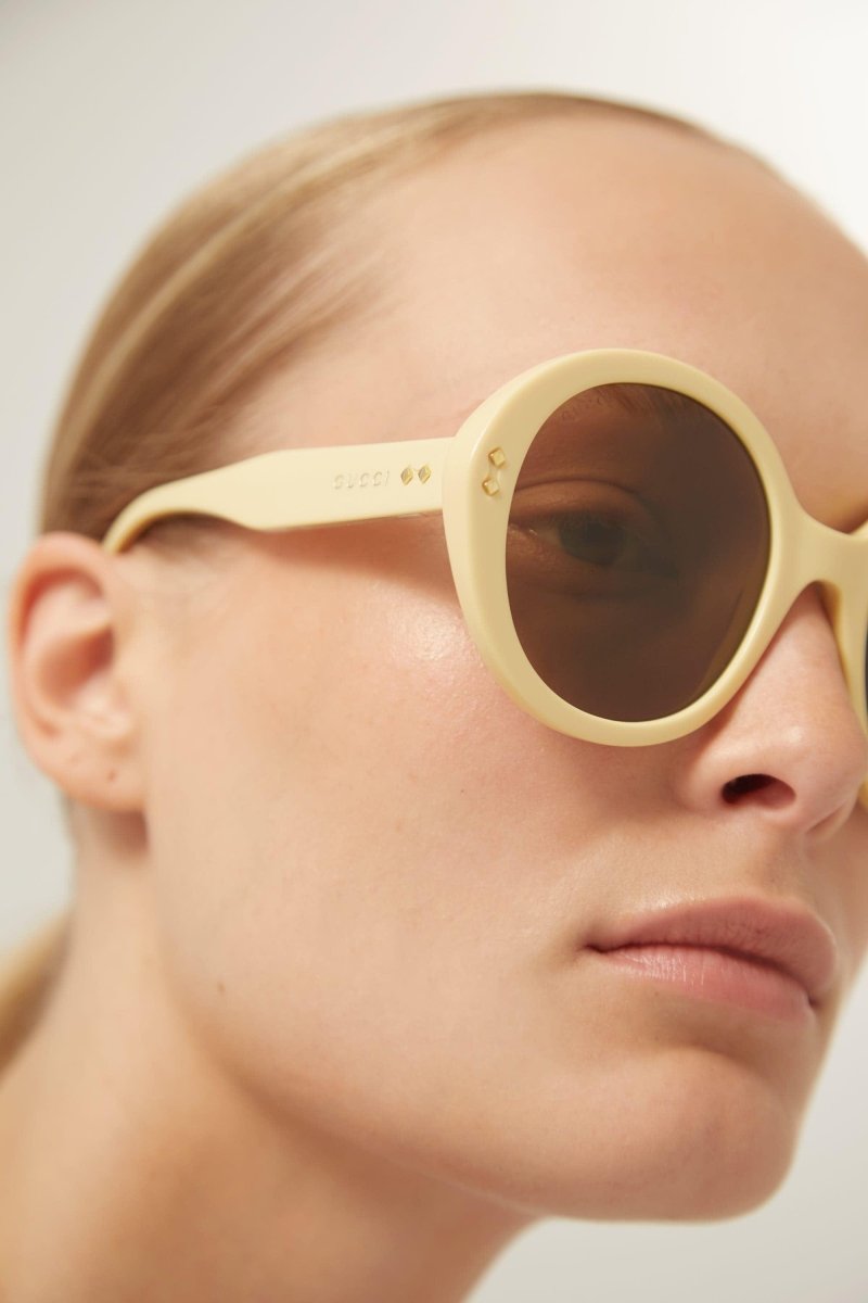 Round ivory sunglasses – there’s a golden light; Marcello, an aspiring novelist is taking a stroll and out – LUX VERSE Luxury Designer Fashion Outlet