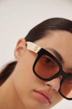 Squared femenine black and ivory sunglasses – pared-back simplicity characterises the essential shapes, lines and colours of this – LUX VERSE Luxury Designer Fashion Outlet