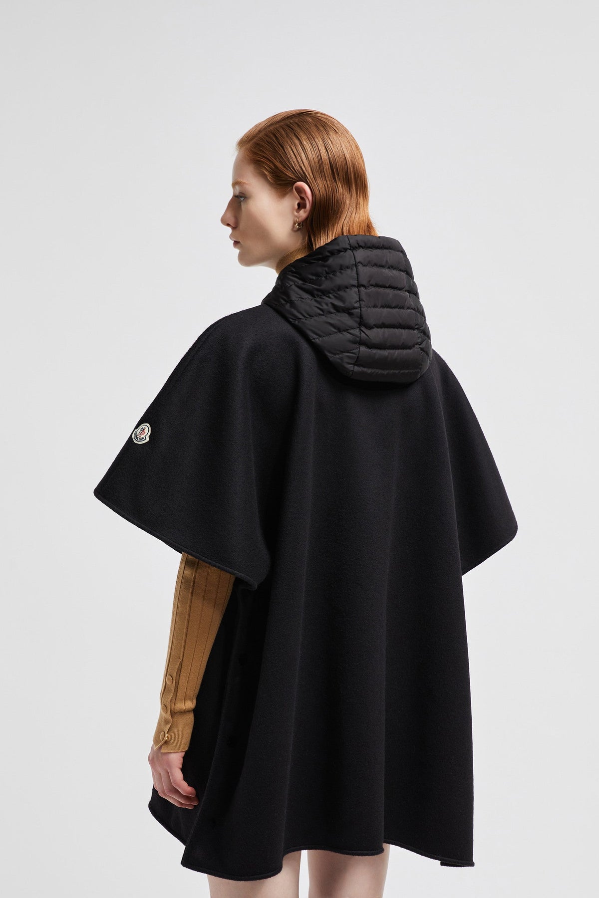 Hooded Down Cape – perfect for layering over other lighter pieces, the design is down-filled and boasts – LUX VERSE Luxury Designer Fashion Outlet