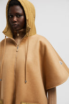 Hooded Down Cape – crafted from wool cloth Nylon hood and pocket Down-filled Zipper closure – LUX VERSE Luxury Designer Fashion Outlet