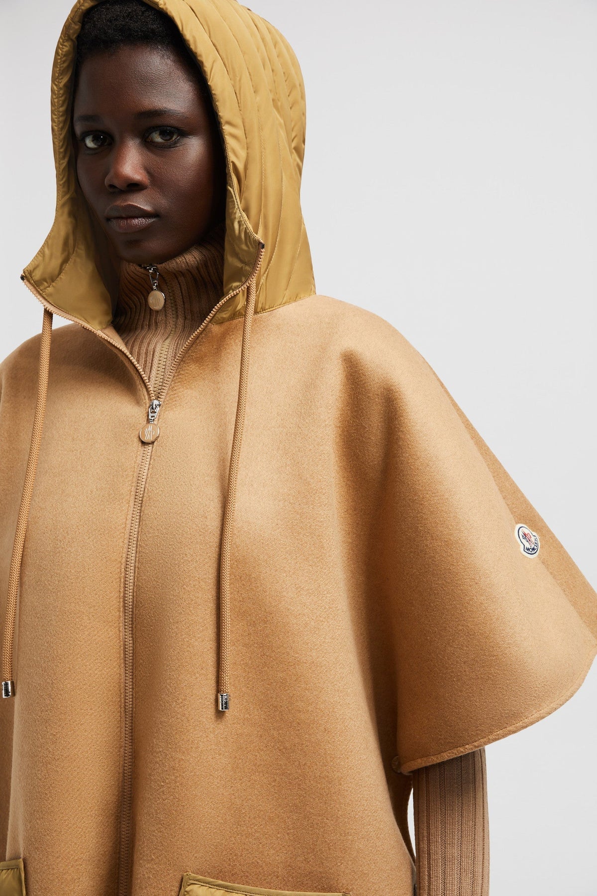Hooded Down Cape – crafted from wool cloth Nylon hood and pocket Down-filled Zipper closure – LUX VERSE Luxury Designer Fashion Outlet