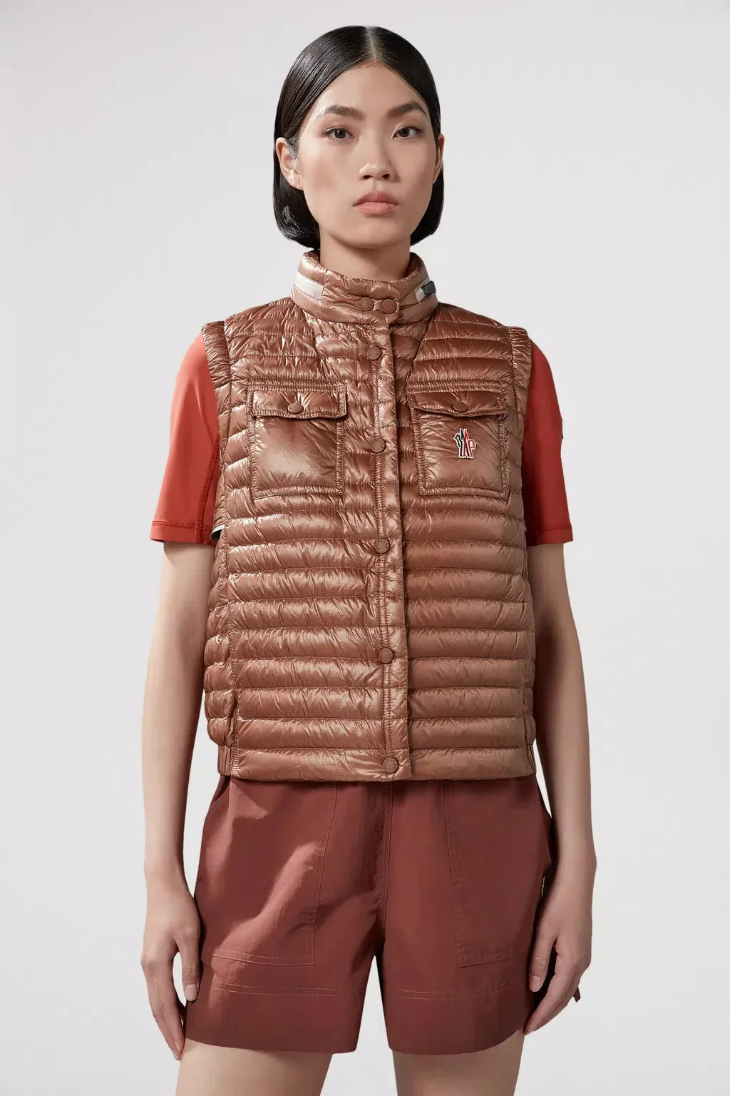 Gumiane Down Vest – the lightweight warmer is finished with a pull-pout hood and reflective details – LUX VERSE Luxury Designer Fashion Outlet