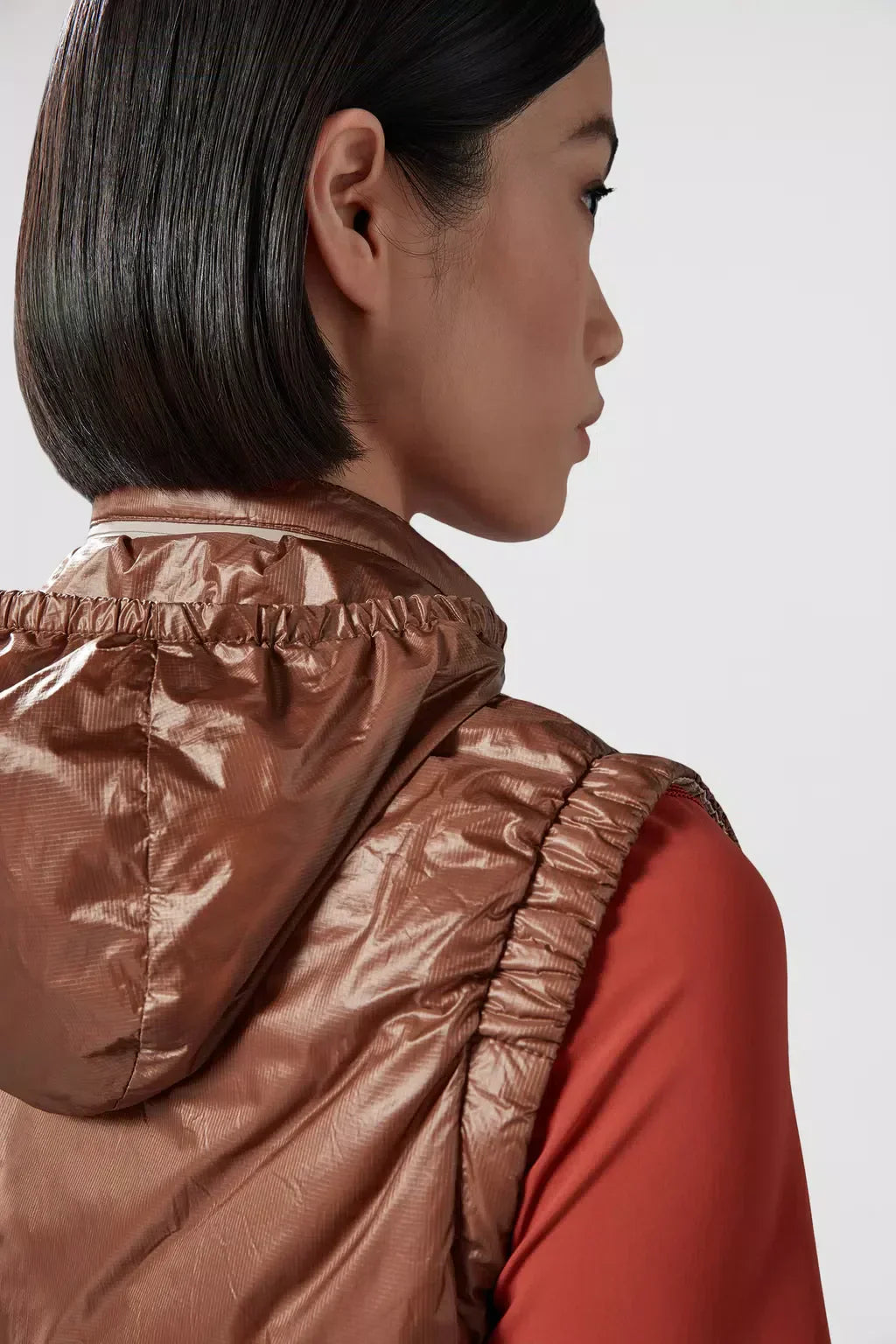 Gumiane Down Vest – the lightweight warmer is finished with a pull-pout hood and reflective details – LUX VERSE Luxury Designer Fashion Outlet