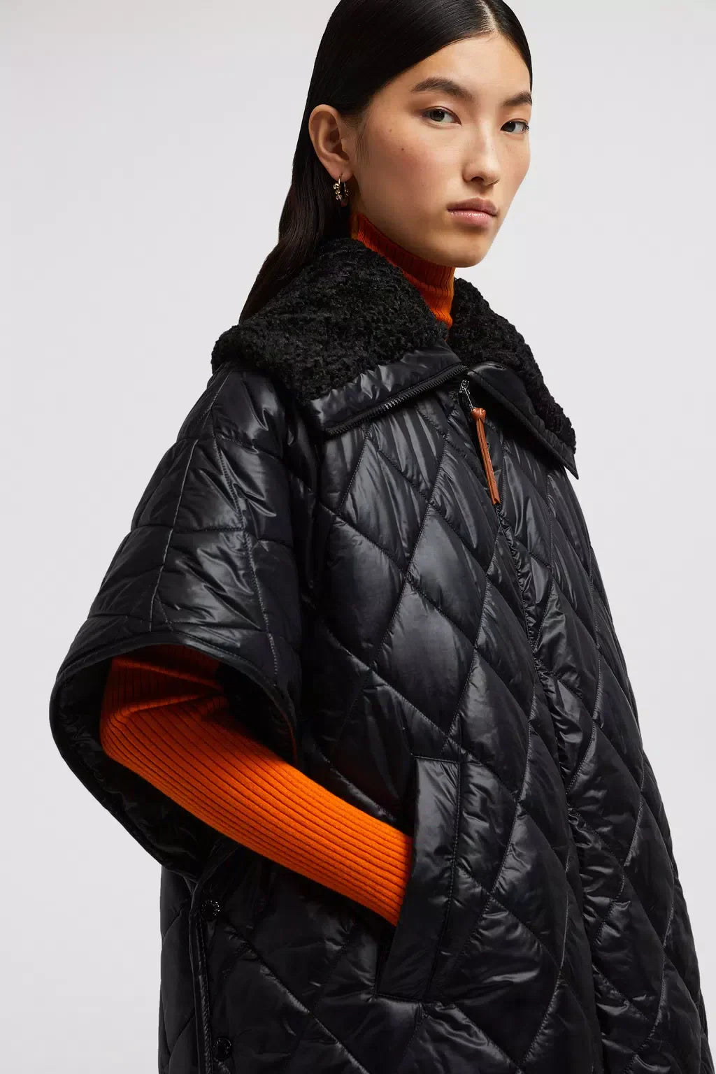 Padded Cape – the padded design is crafted from diamond-quilted nylon, offering warmth while – LUX VERSE Luxury Designer Fashion Outlet