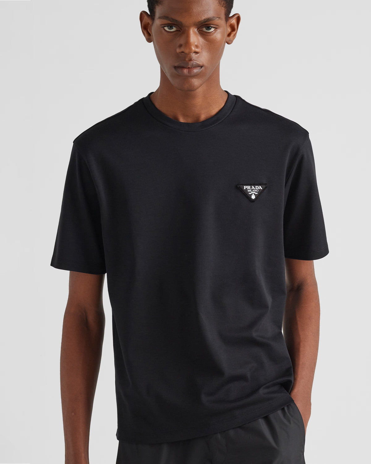 Cotton T-shirt – blending sophistication and simplicity, the short-sleeved crew-neck garment is – LUX VERSE Luxury Designer Fashion Outlet