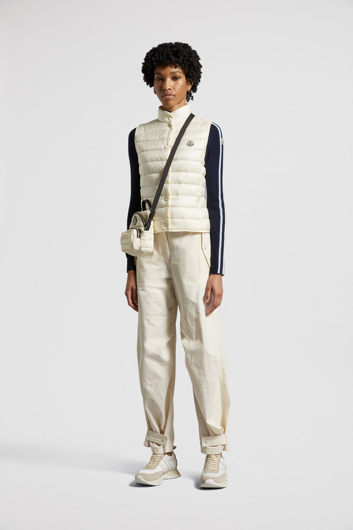 Liane Down Vest – it is characterized by a high neck and a subtle logo patch on the chest – LUX VERSE Luxury Designer Fashion Outlet
