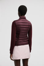 Liane Vest – it is characterized by a high neck and a subtle logo patch on the chest – LUX VERSE Luxury Designer Fashion Outlet