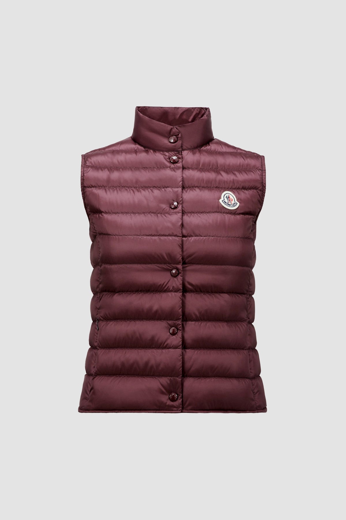 Liane Vest – it is characterized by a high neck and a subtle logo patch on the chest – LUX VERSE Luxury Designer Fashion Outlet