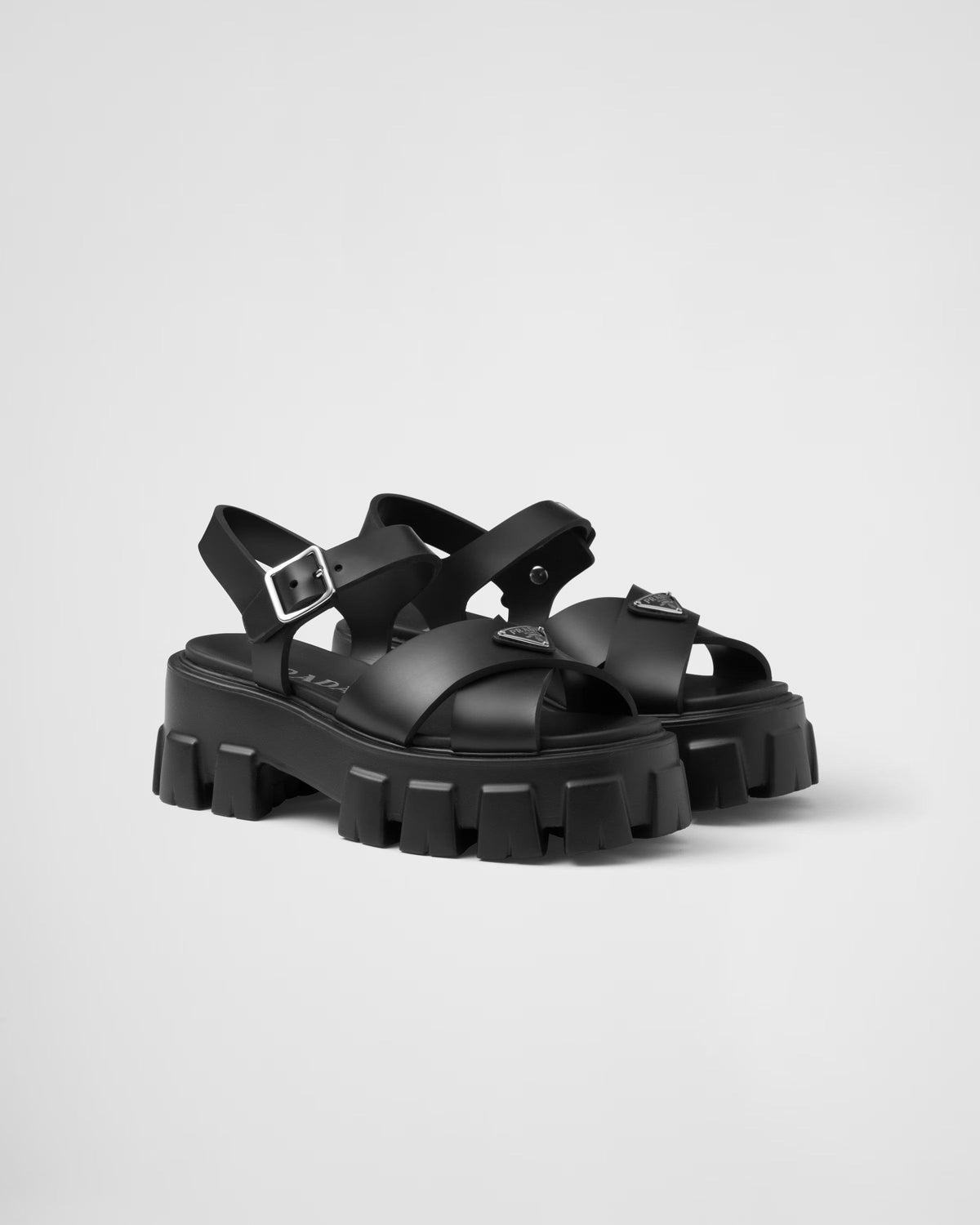 Monolith Rubber Sandals – upper with metal buckle Enameled metal triangle logo Rubber sole: 55 mm Lug sole – LUX VERSE Luxury Designer Fashion Outlet