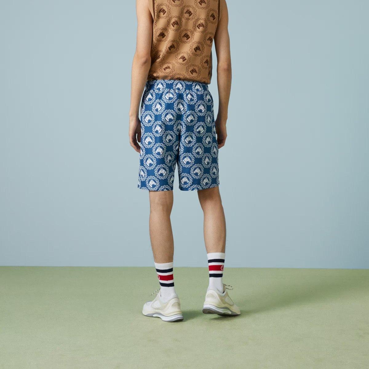 Nylon equestrian print swim shorts – crafted from blue and ivory nylon, this pair of swim shorts features an equestrian – LUX VERSE Luxury Designer Fashion Outlet