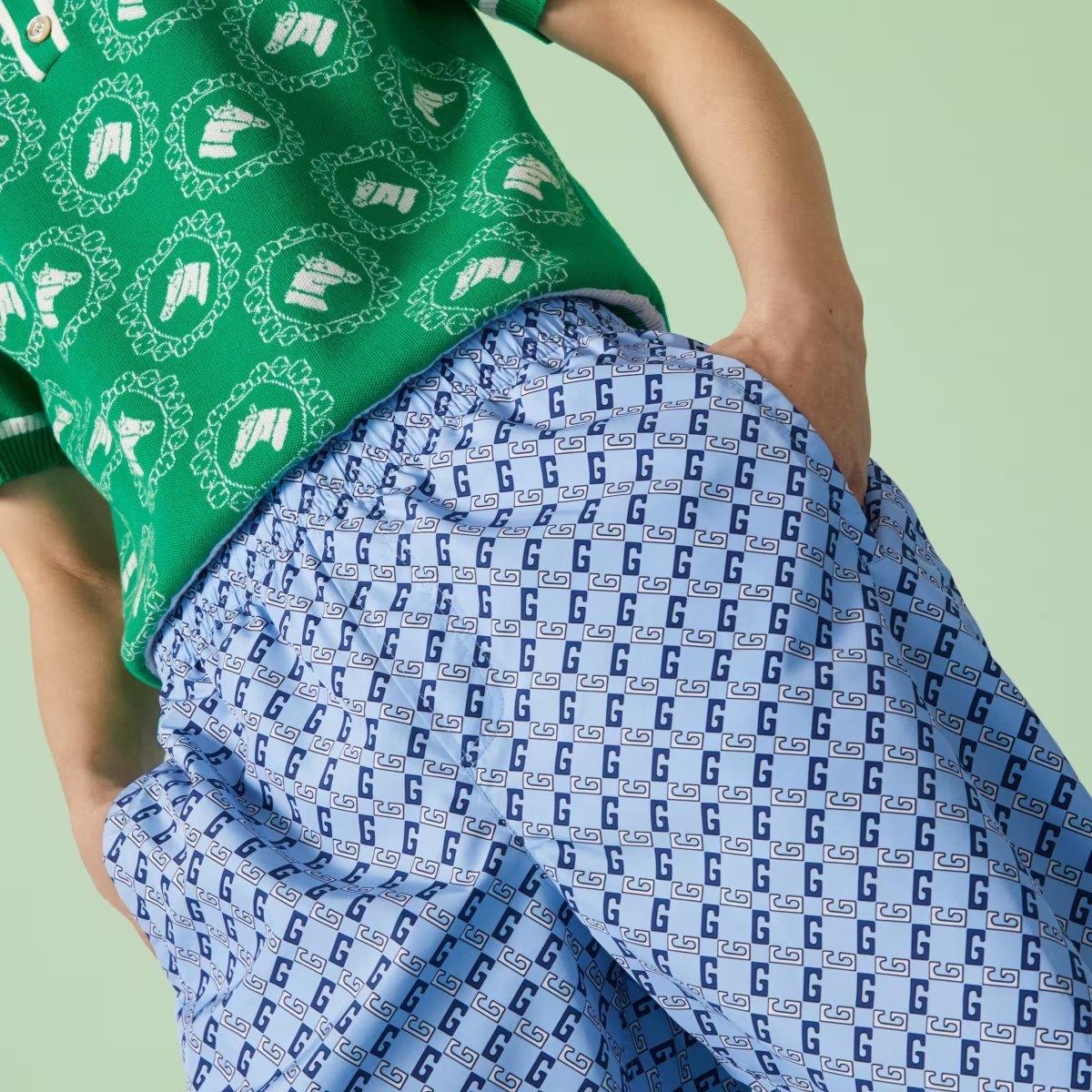 Nylon printed swim shorts – a mix of colors and textures overlap to form new, unconventional designs – LUX VERSE Luxury Designer Fashion Outlet