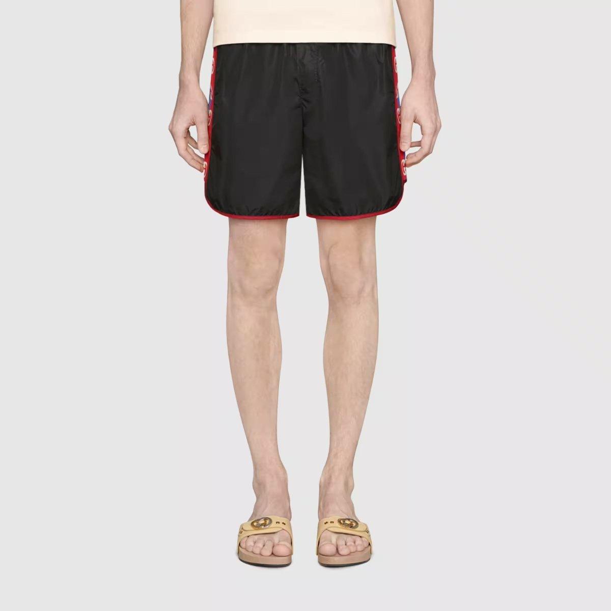 Nylon swim shorts with logo stripe – crafted from waterproof nylon, the design is completed by an elastic waistband with – LUX VERSE Luxury Designer Fashion Outlet