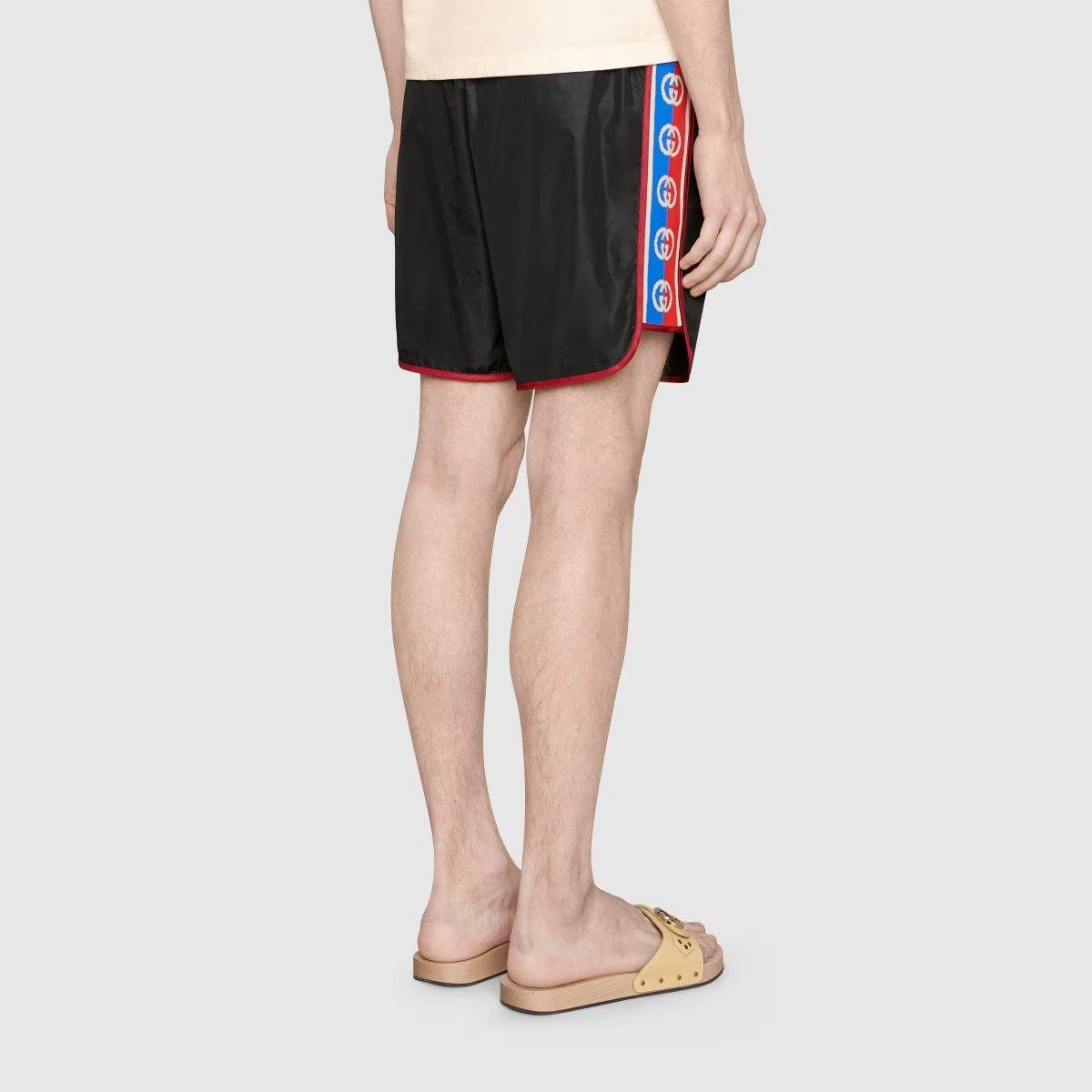Nylon swim shorts with logo stripe – black waterproof nylon Red trims Blue, white and red Interlocking G jacquard stripe – LUX VERSE Luxury Designer Fashion Outlet