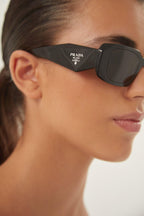 PR17WS symbol black oval sunglasses – sunglasses for women include a wide range of silhouettes and colors – LUX VERSE Luxury Designer Fashion Outlet